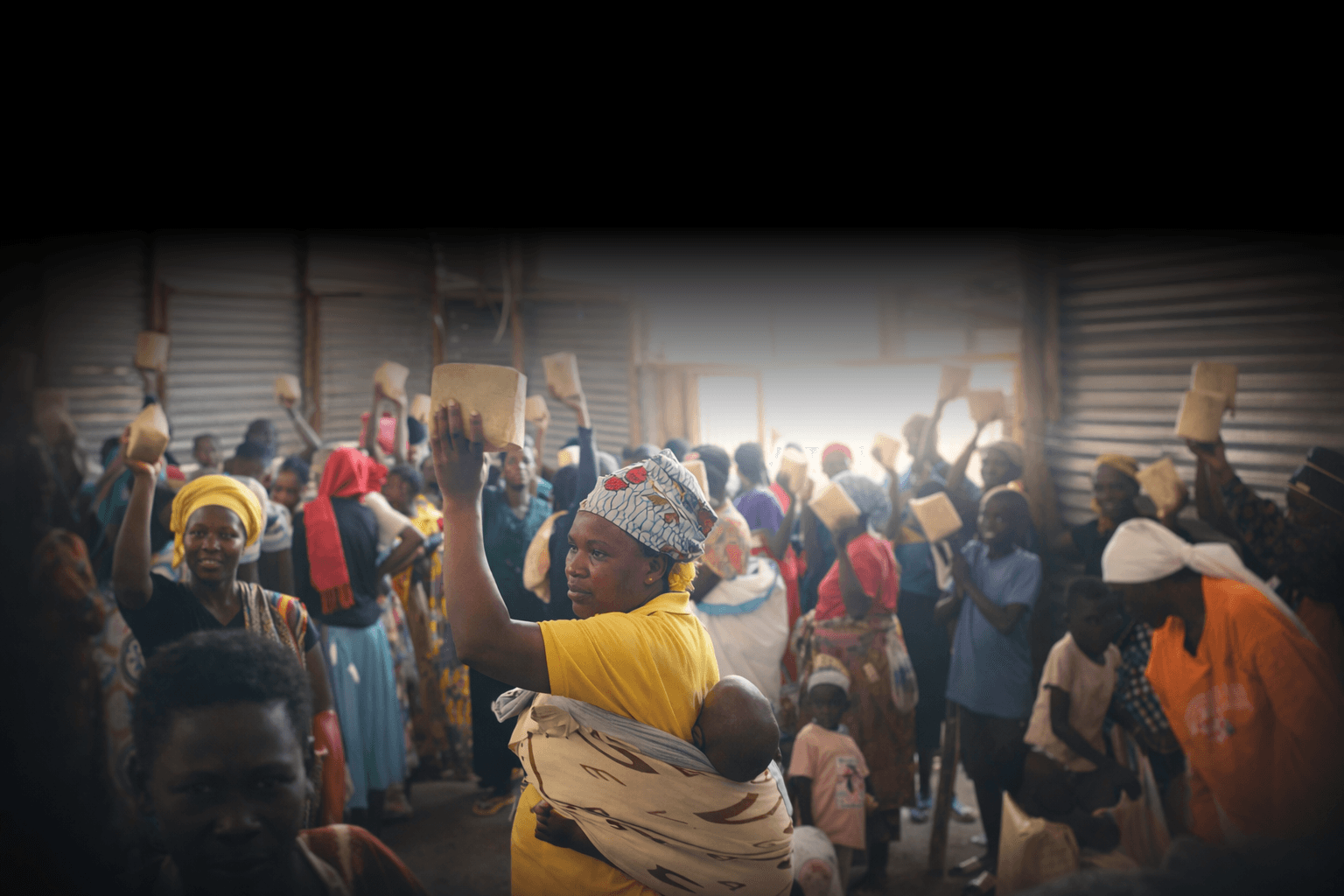 Community members receiving Amazing Food porridge packages